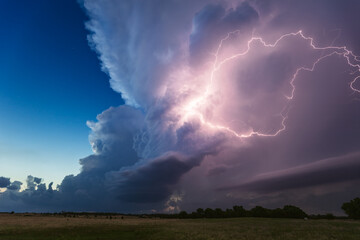 Thunderstorm cloud illuminated by lightning