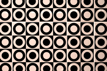 Abstract background of black and white perforated circles pattern on beige tile wall decoration