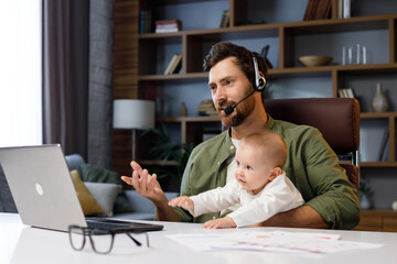 Father on maternity leave, holding an online conference, a meeting in the home office with a small...