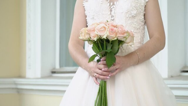 Beautiful vintage style wedding bouquet in the hand of teh bride