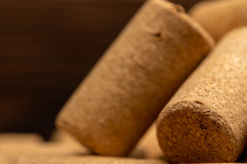 Wine corks scattered on a wooden background. Close-up, selective focus