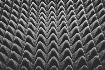 Abstract black - white background with uneven surface. Corrugated surface with a visual effect. Black and white pattern.