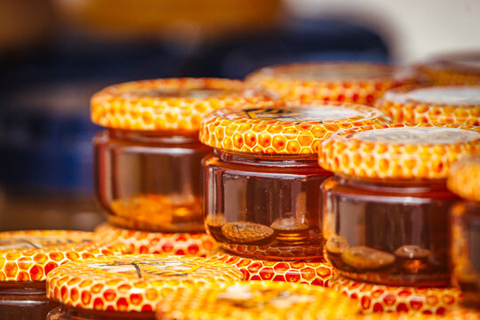 Honey jars stacked close-up.