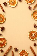 Frame of dried slices of orange, cinnamon sticks, anise stars. Autumn fall poster design. Flat lay, top view, copy space.