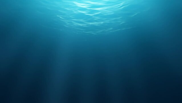 Animation of sea waves seen from an underwater environment where light rays filter from the surface. 3D Rendering