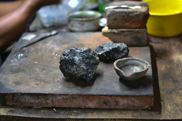Craftsman workshop that works silver with stones and a bowl