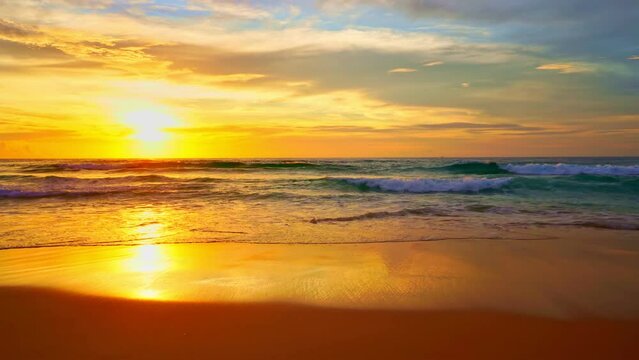Sea at sunset or sunrise over beach video 4K, The sun touches horizon, Red sky in golden hour amazing seascape,Ocean beach sunsets,The sun in spindrift clouds Fantastic natural sunsets