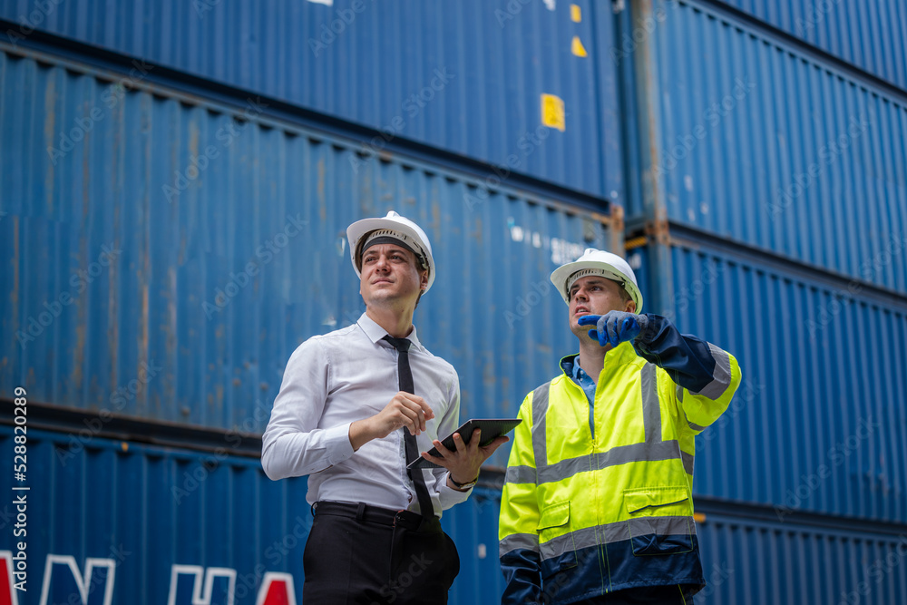 Poster engineers are overseeing the transportation of cargo with containers inside the warehouse,logistic a