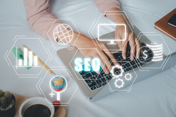 SEO Concept, Search Engine Optimization, Woman hand using laptop computerwith VR screen seo icon,...