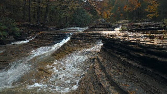 Six finger falls Arkansas as a creek water cascade runs down unique rock structure in the natural waterfall scene during Autumn  