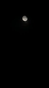 Moon in a Dark Night Sky and Clouds Poetic Romantic Gothic Halloween Nocturnal Scene Vertical Video Real Time