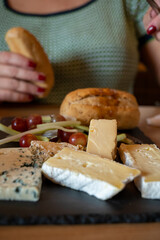 Tasting of farmers scottish cheeses cheddar, stilton, blue cheese, brie in Edinburgh, UK
