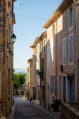 VIew on medieval buildings in sunny day, vacation destination wine making village Chateauneuf-du-pape in Provence, France