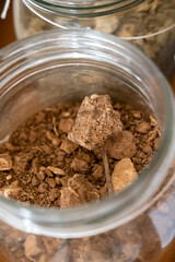 Different samples of soils in Climat of origin, grand cru wine tasting in underground cellars caves of French wine domain in Puligny-Motrachet village, Burgundy, France