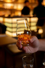 Tasting of single malt scotch whisky in whiskey bar in Edinburgh, UK