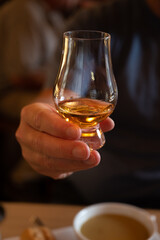 Tasting of single malt scotch whisky in whiskey bar in Edinburgh, UK