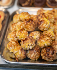 Variety of cookies and cakes on display in artisanal bakery in San Sebastian city, Basque Country, Spain