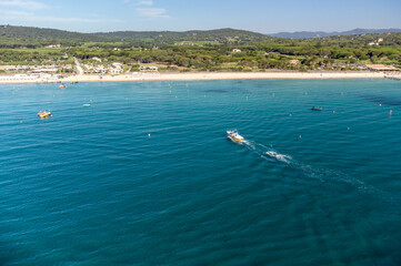 Aerial view of legendary Pampelonne beach near Saint-Tropez, summer vacation on white sandy beaches of French Riviera, France
