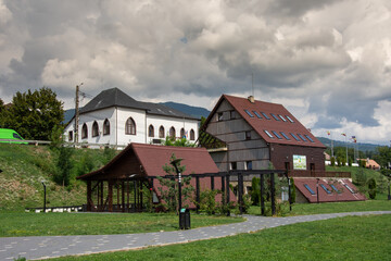 Fototapeta na wymiar Park and City Hall, Prundu Bargaului, Romania, 2022