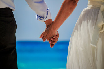 Wedding couple hands are taking each other