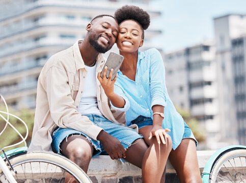 City travel, bicycle and selfie couple with smartphone on a date, vacation or summer holiday. Happy portrait man and woman or black people smile in photo for social media content or vlogging memories