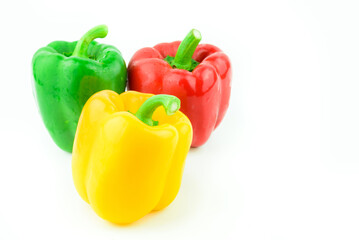 Fresh colorful sweet bell peppers on white background