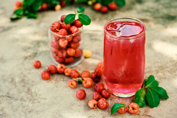 Glass of sour cherry juice with fresh red cherries, Cherry juice, on wood background, red drink, High vitamin C and antioxidant fruits.