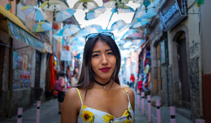 brunette woman looking straight ahead in the streets of bolivia