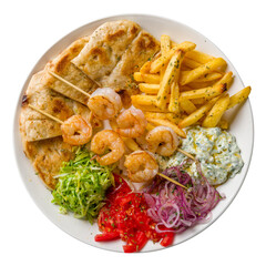 souvlaki with shrimp kebab, french fries, vegetables and pita isolated on white background top view