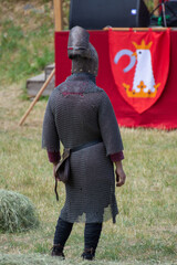 knight in combat costume, seen from behind, in Bistrita, Romania, 2022