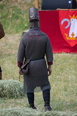 knight in combat costume, seen from behind, in Bistrita, Romania, 2022