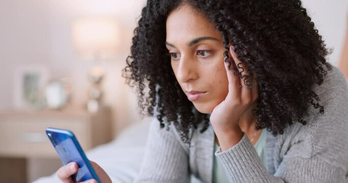 Lonely, bored and young woman on mobile phone, social media and texting web apps in home bedroom. Sad, alone and unhappy female in isolation waiting online connection, mobile and internet technology