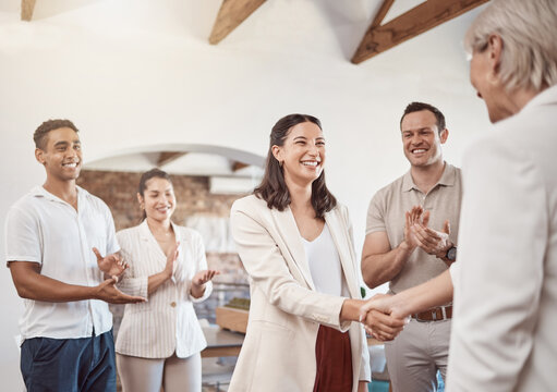 Business handshake with clapping workers in the work office. Professional company b2b shaking hands for a deal to come and work together. Diverse group of happy staff thank you and welcome employee