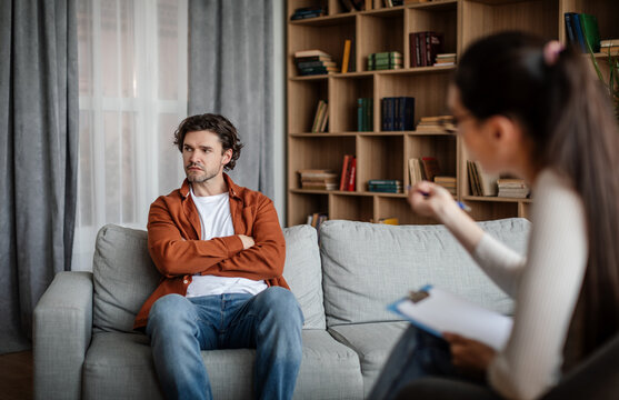 European Young Woman Psychologist Talk With Dissatisfied Guy, Patient Ignoring Doctor Advice