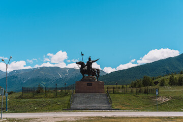 Monument of a warrior standing next to a horse in the eastern part of Kazakhstan.