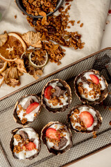 Cookie cone filled with cream and strawberries