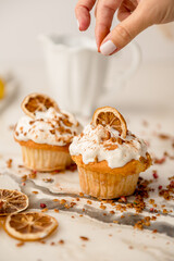 Lemon frosted cupcakes with granola