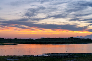 Sunrise reflecting off the tidal marsh near Cape Point in the Outer Banks Hatteras Island