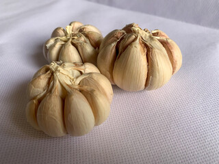 Garlic on a white background. a versatile food ingredient used in many cooked