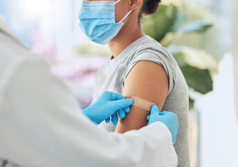 Covid vaccine with medical doctor or healthcare nurse hands with plaster on arm after medicine...