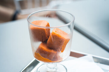 Tea ice cubes in glass