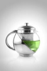 Transparent aluminum teapot isolated on white background