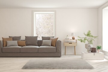 White living room with sofa and winter landscape in window. Scandinavian interior design. 3D illustration