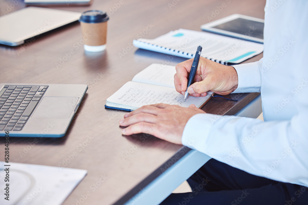 Poster writing, notebook and planning with a business man working at his desk in the office and taking note