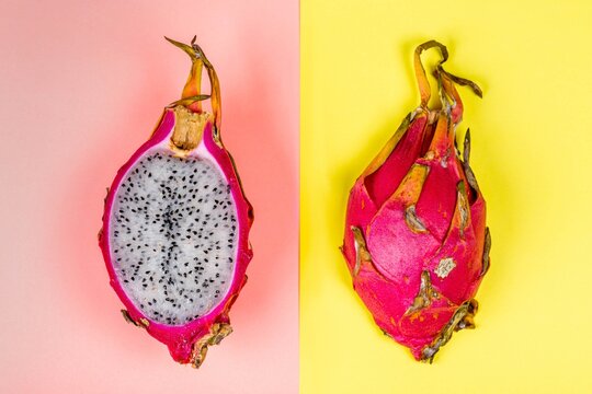 Top view, dragon fruit on pink and yellow background