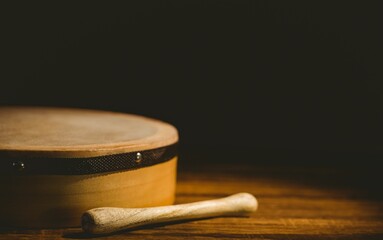 Close-up of bodhran with stick