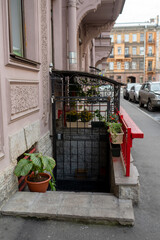 closed entrance to the basement decorated with flower pots