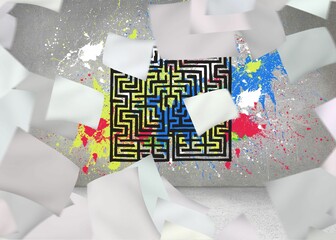 Papers in front of grey wall with maze and splashes