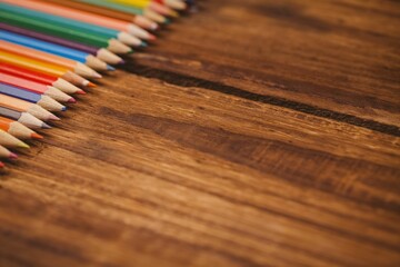 Color pencils on wooden table