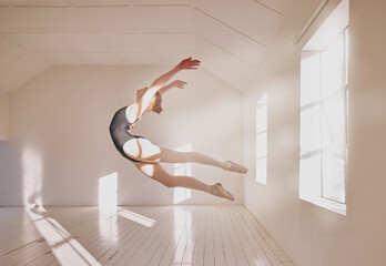 Woman ballet dancer dancing in a dance studio mockup white walls and sunlight. Young professional...